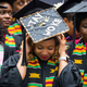 A graduate adjusts her cap as she takes part in the Black Commencement at Harvard University in Cambridge, Mass., on May 23, 2017. One hundred seventy students attended the universitywide ceremony for black students at Harvard, designed to celebrate their unique struggles and achievements at the elite institution.